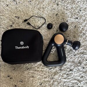 Theragun Black and Gold Massage Device